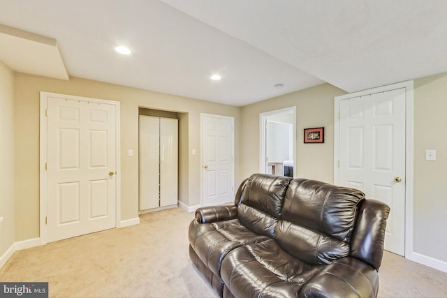 living room with light carpet, baseboards, and recessed lighting