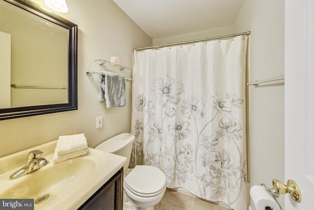 full bathroom featuring tile patterned flooring, a shower with shower curtain, vanity, and toilet