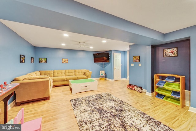 living area with ceiling fan, baseboards, wood finished floors, and recessed lighting