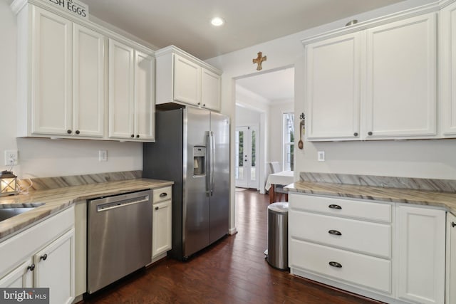 kitchen featuring dark wood-style flooring, crown molding, recessed lighting, appliances with stainless steel finishes, and white cabinetry