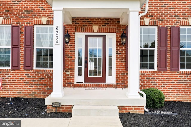 entrance to property with brick siding