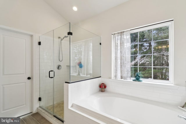 full bath featuring a stall shower, a bath, and recessed lighting