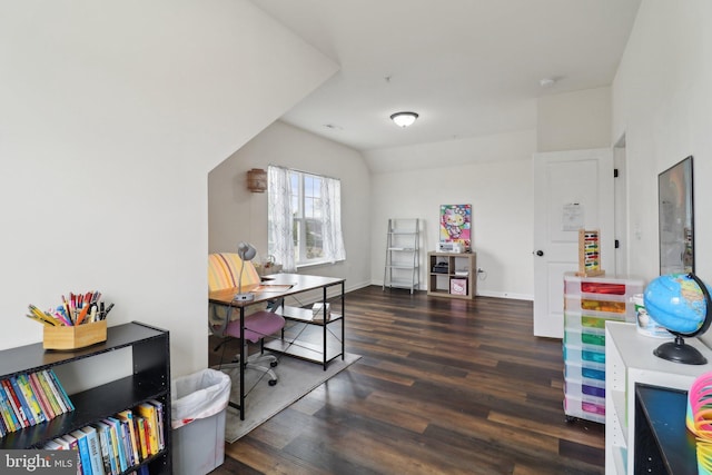 home office featuring lofted ceiling, wood finished floors, and baseboards