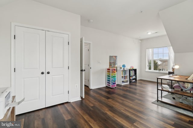 rec room featuring dark wood-type flooring and baseboards