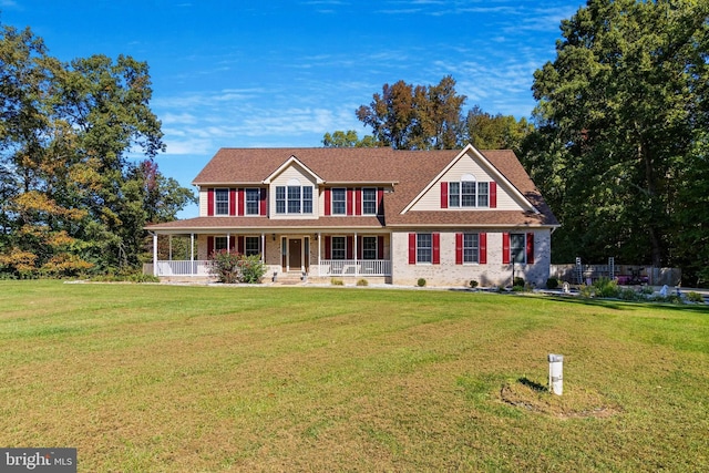 view of front of property featuring a front lawn and a porch