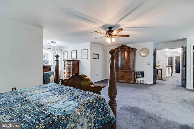 carpeted bedroom with ceiling fan and baseboards