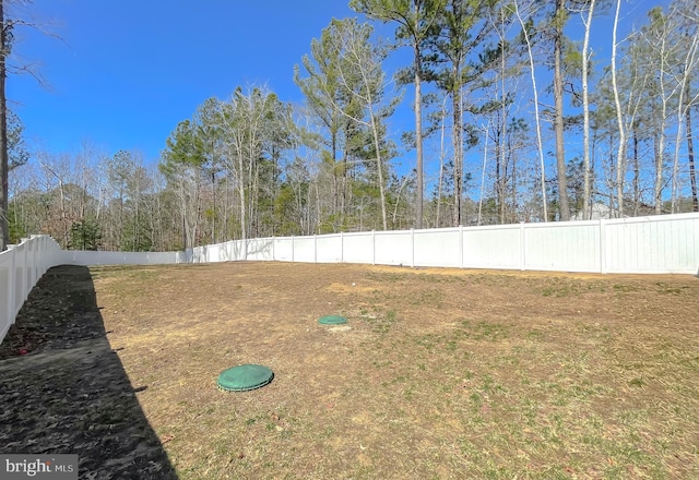 view of yard with a fenced backyard