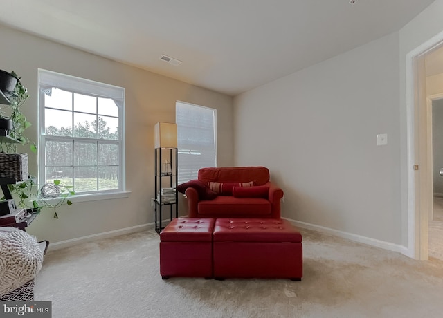 sitting room featuring carpet, visible vents, and baseboards