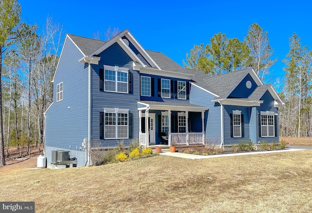 view of front of house featuring covered porch and central AC