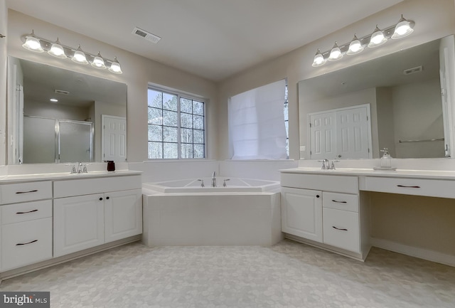 full bathroom with a sink, visible vents, a bath, and a shower stall