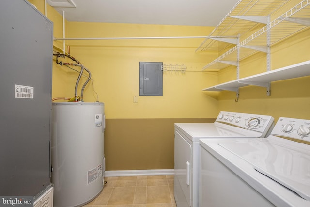 clothes washing area featuring electric panel, water heater, separate washer and dryer, light tile patterned flooring, and laundry area