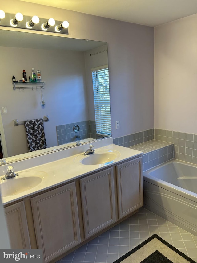 bathroom featuring a bath, a sink, and tile patterned floors