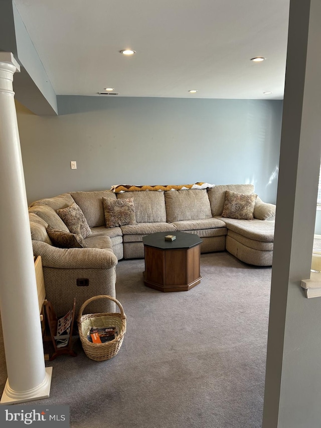 living area with carpet, decorative columns, and recessed lighting