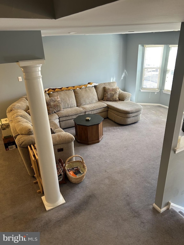 carpeted living room with baseboards