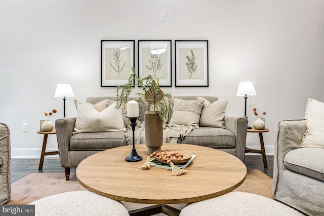 living room with wood finished floors and baseboards