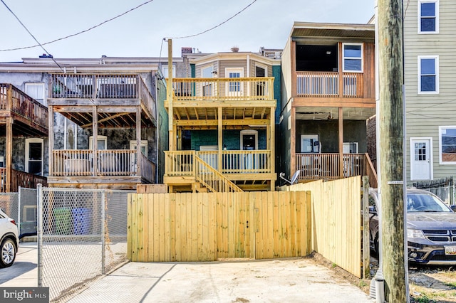 rear view of property with fence