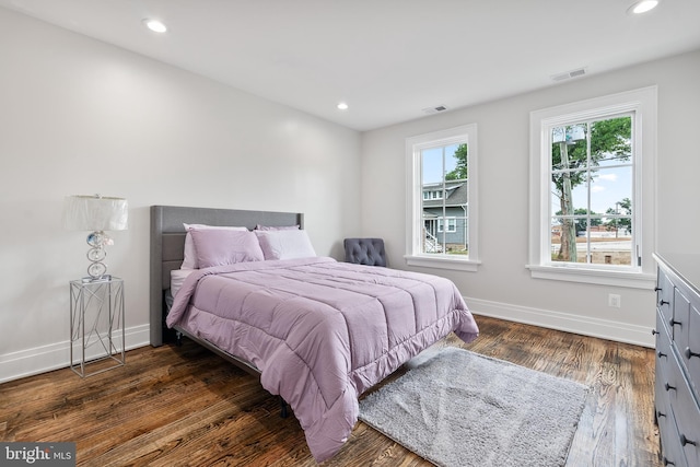 bedroom featuring recessed lighting, visible vents, baseboards, and wood finished floors