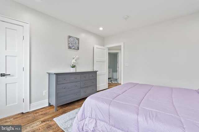 bedroom featuring recessed lighting, baseboards, and wood finished floors