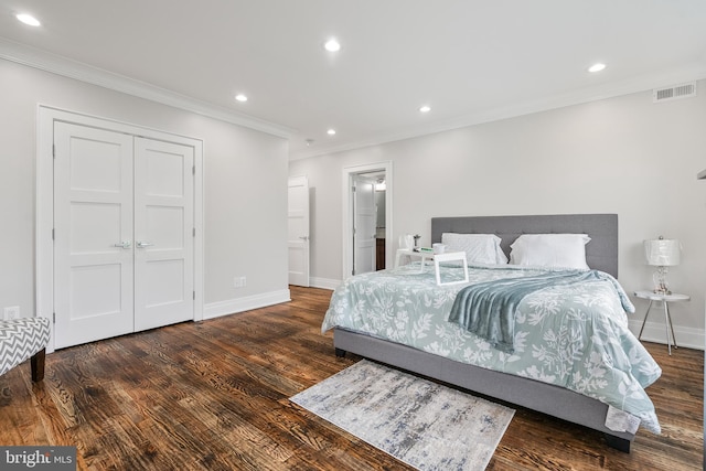 bedroom with recessed lighting, visible vents, wood finished floors, and ornamental molding