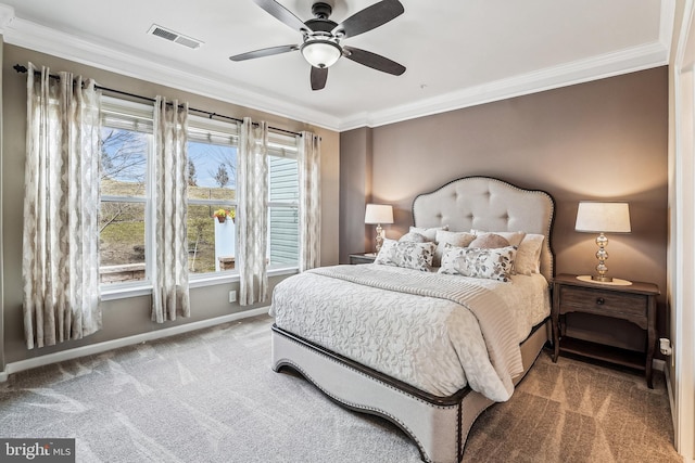 bedroom with a ceiling fan, baseboards, visible vents, crown molding, and carpet flooring