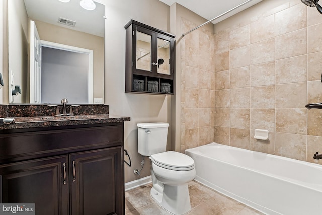 bathroom with vanity, baseboards, visible vents, toilet, and shower / bathtub combination