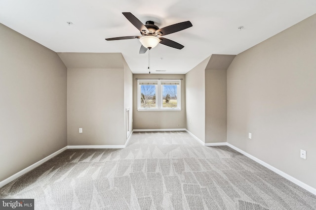 additional living space with baseboards, carpet floors, and ceiling fan