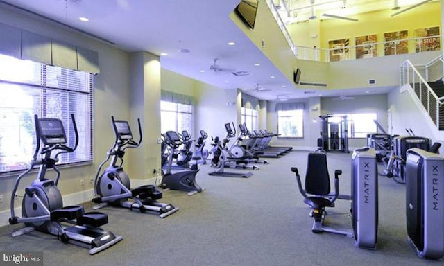 gym featuring recessed lighting and baseboards