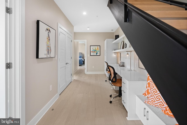 home office with recessed lighting, baseboards, light wood-style floors, and built in study area