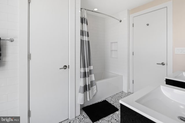 full bathroom with vanity and shower / bathtub combination with curtain