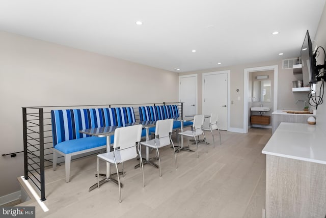 dining space featuring recessed lighting, visible vents, baseboards, and wood finished floors