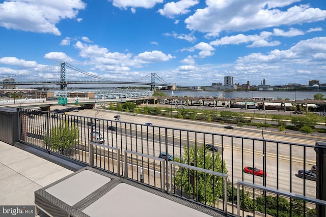 balcony with a view of city and a water view