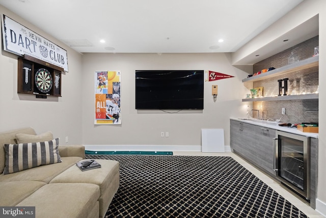 living area with recessed lighting, baseboards, wine cooler, and wet bar