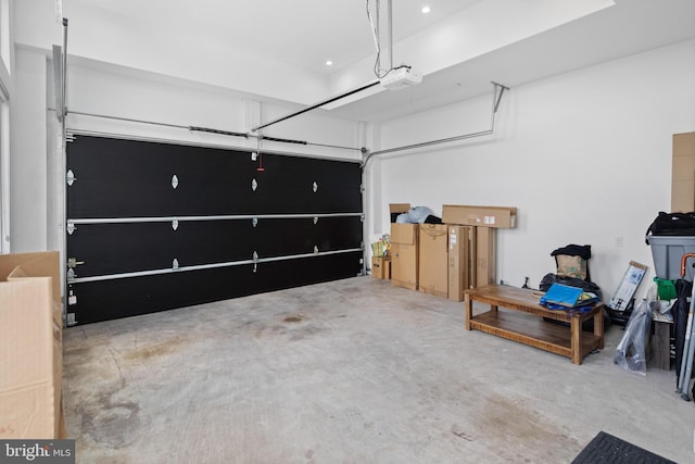 garage featuring recessed lighting and a garage door opener