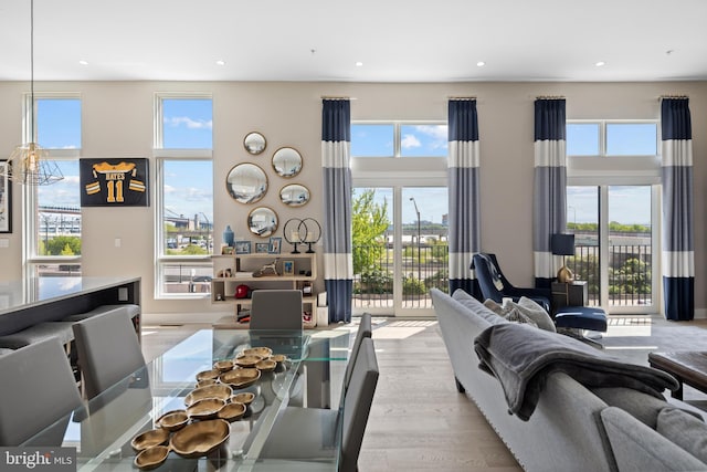 living room featuring recessed lighting, wood finished floors, and a wealth of natural light