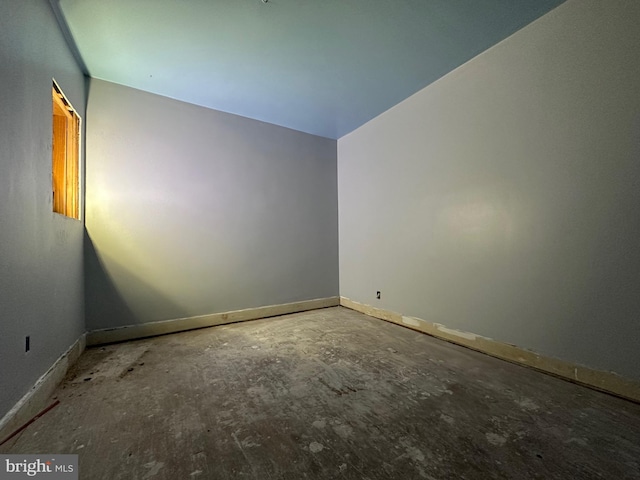 empty room with baseboards