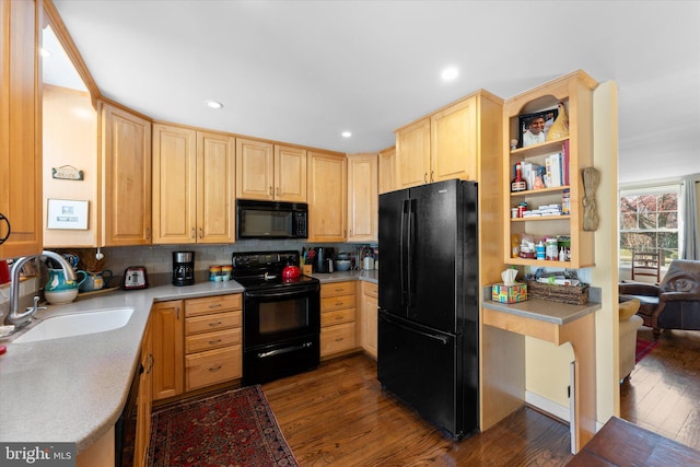 kitchen with dark wood-style flooring, decorative backsplash, light brown cabinetry, a sink, and black appliances