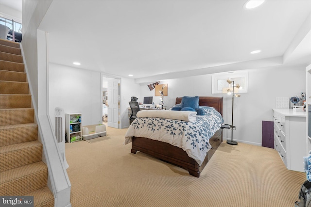 carpeted bedroom featuring baseboards and recessed lighting