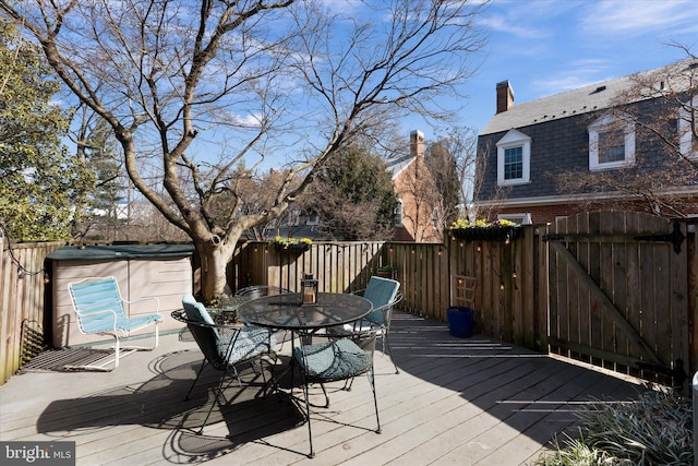 deck with fence and outdoor dining area