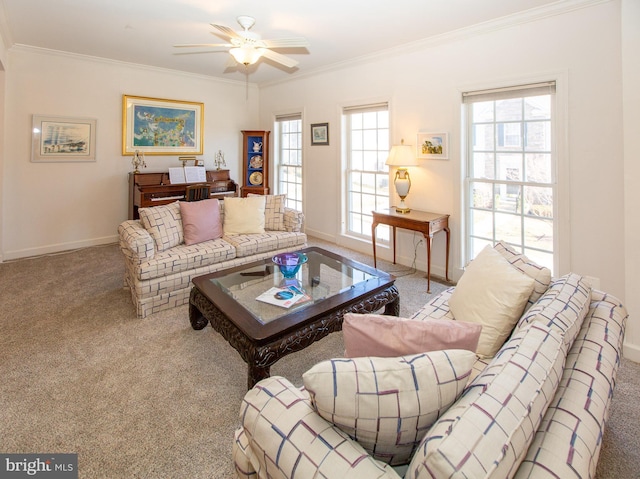 living room with crown molding, carpet, and baseboards