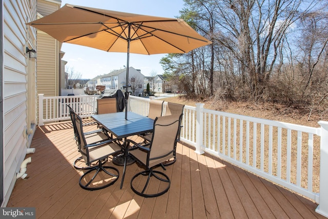 wooden deck with outdoor dining space