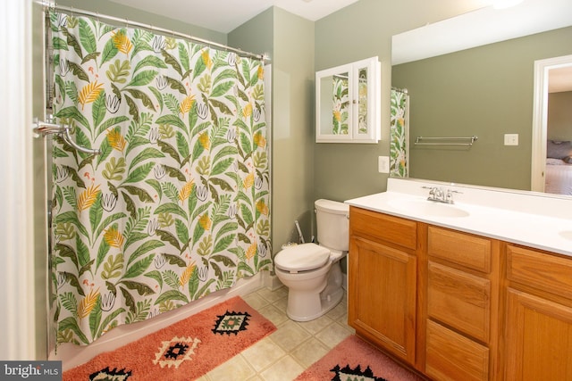 bathroom featuring vanity, tile patterned floors, toilet, and a shower with curtain