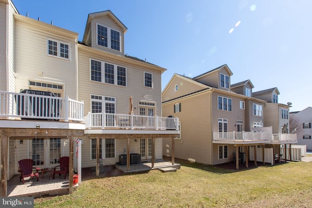 back of property featuring a patio area, central AC unit, and a yard