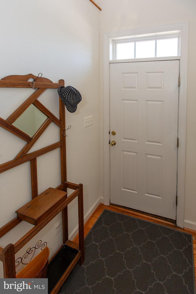 entrance foyer with light wood finished floors and baseboards