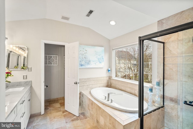 bathroom with a garden tub, a shower stall, visible vents, and vaulted ceiling