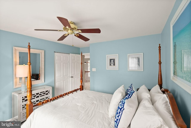 bedroom with ceiling fan and a closet