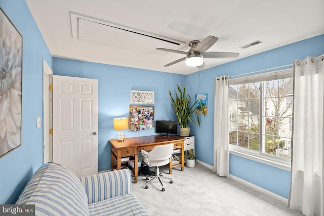 office featuring a wealth of natural light, carpet, visible vents, and baseboards