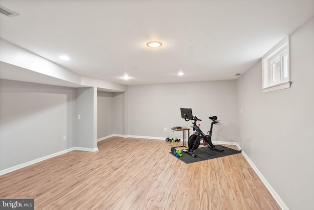 workout area with visible vents, baseboards, wood finished floors, and recessed lighting