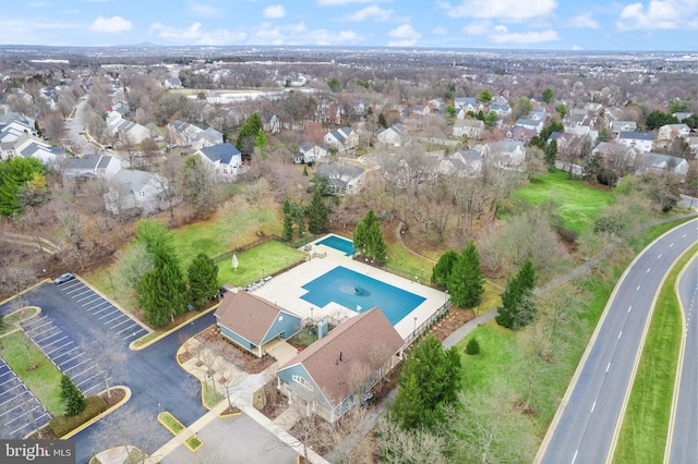 birds eye view of property with a residential view