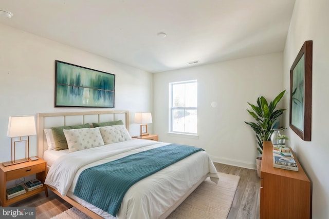 305 Poplar Ave, Newark, DE 19711 - bedroom with wood finished floors, visible vents, and baseboards