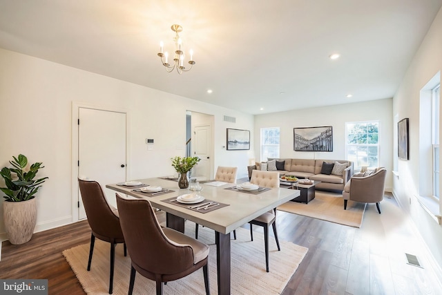 305 Poplar Ave, Newark, DE 19711 - dining space featuring dark wood-type flooring, visible vents, a notable chandelier, and baseboards